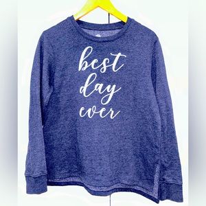 Navy blue pullover sweater that says “ best day ever” on the front